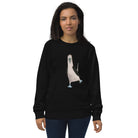 Woman wearing black organic cotton sweatshirt with white penguin graphic from Booby