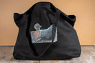 Black Organic Cotton Tote Bag with a bird design from Loonar Landing, large size