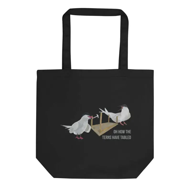 Black organic cotton tote bag featuring two white birds and the text Terns Have Tabled