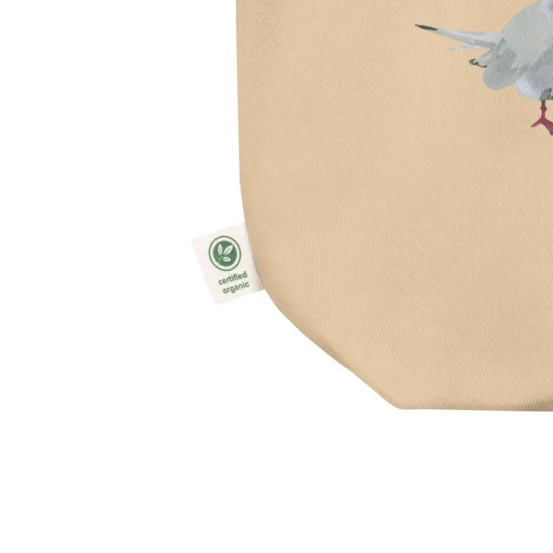 Organic cotton tote bag featuring a small bag with a bird design by Terns Have Tabled