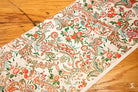 Colorful Japanese Chiyogami hand designed floral patterned fabric on wooden surface