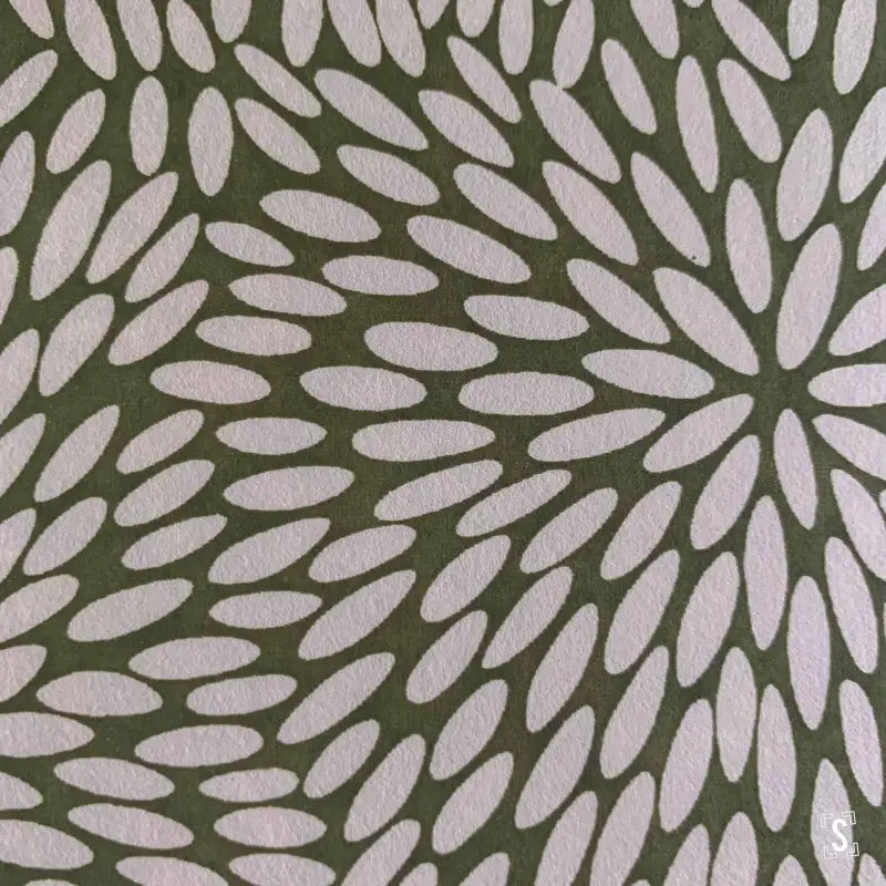 Abstract floral pattern of white petal shapes on green, featuring Japanese Chiyogami prints