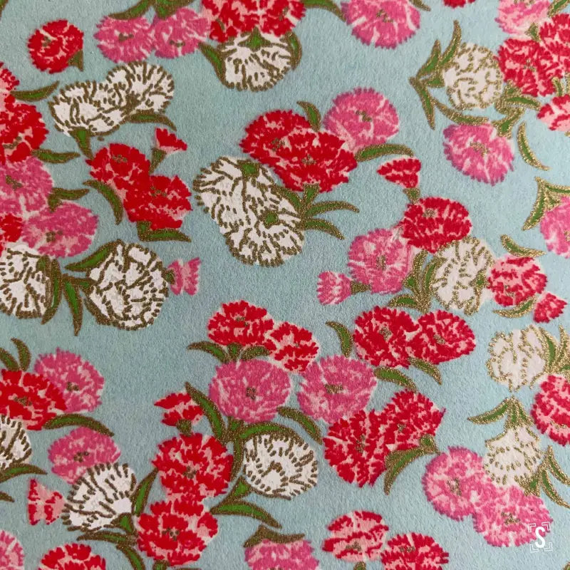 Floral pattern Japanese Chiyogami fabric with red, pink, and white carnations on blue