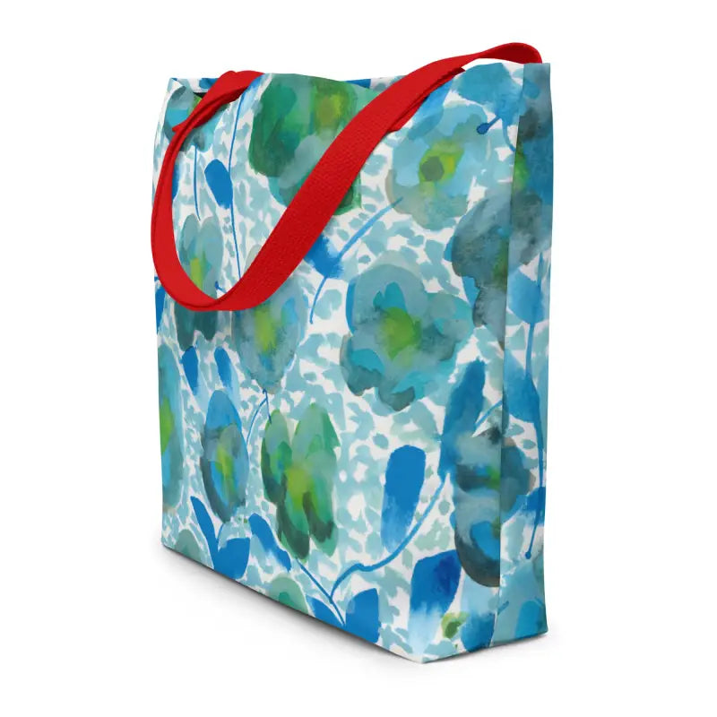 Tote bag with hand designed blue and green floral prints and red handles