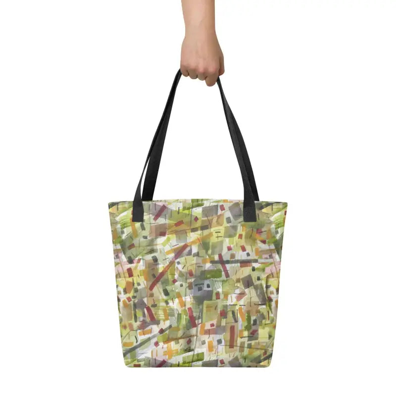 Woman’s hand holding a hand designed Green Abstract Tote Bag for stylish shopping