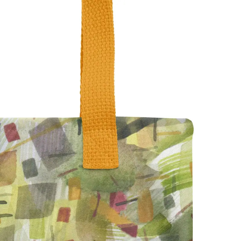 Colorful hand designed tote bag with yellow handle featuring green abstract artwork