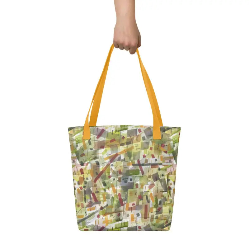 Woman holding a hand designed tote bag in green abstract pattern