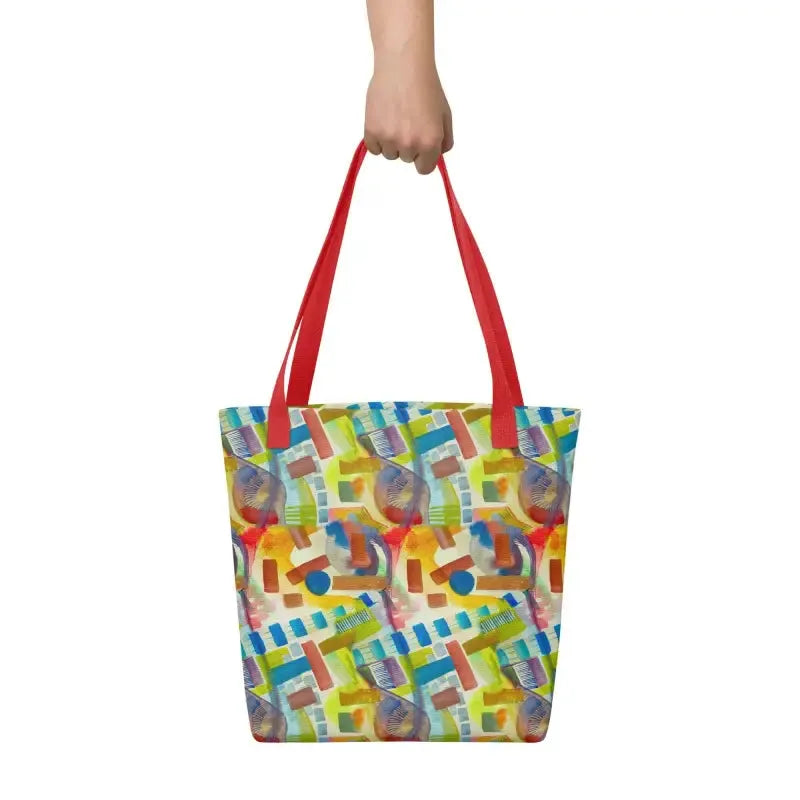 Woman showcasing a hand designed tote bag with a vibrant abstract pattern