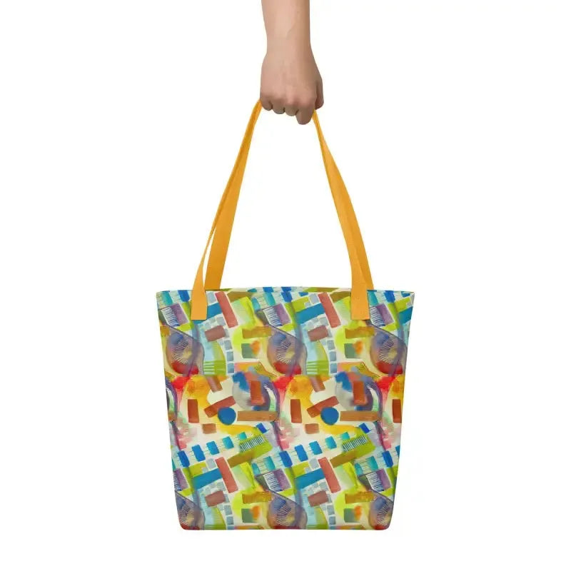 A woman showcasing a hand designed vibrant abstract tote bag in a stylish pose